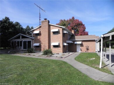 Back of the home has access to backyard with cemen