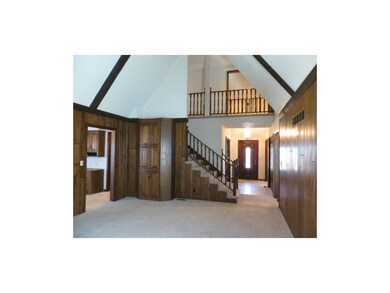 View from great room into entry and upstairs catwa