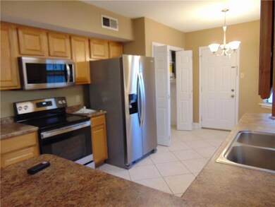 Dinette area off kitchen with enclosed washer and