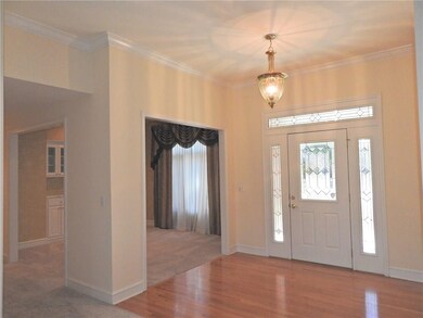 Living rom view of front entry and dining room