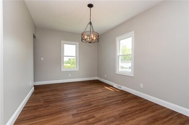 Trendy lighting & an alcove lend style and space t