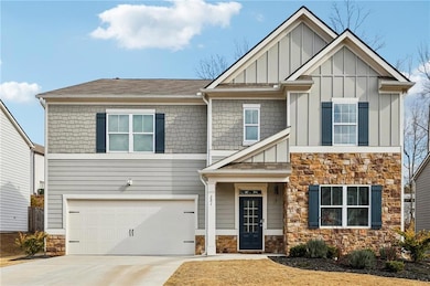Craftsman-style house featuring a garage
