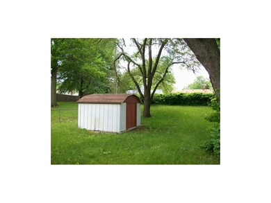 10 X 12 Metal building with concrete floor.