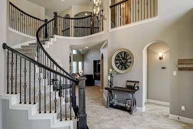 Stunning two story entry with sweeping staircase