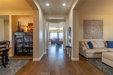 Entrance with formal dining (left) - living room (right) Gorgeous wood flooring.