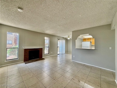 Unfurnished living room with tile patterned floori