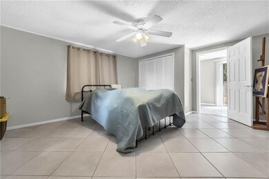 Large Master Bedroom with closet and ceiling fan.