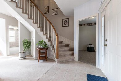 Front staircase, den to the right, main level bedr