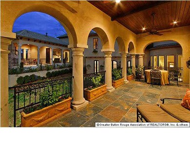 Tiled back patio from Living Room and Kitchen at D