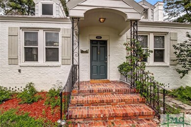 Lovely portico with brick steps.