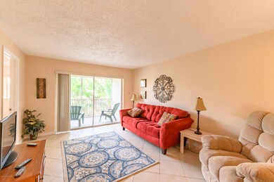 Living Room & View of Screened Balcony