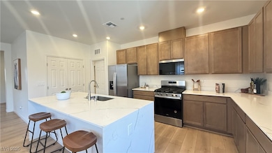 Kitchen featuring appliances with stainless steel
