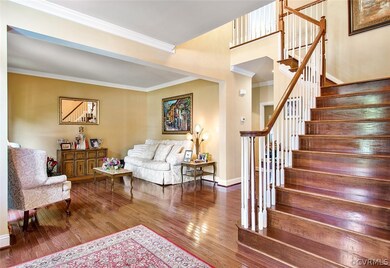 Foyer view into the formal living room and the sta