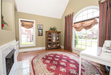Office with fireplace and built in book shelves