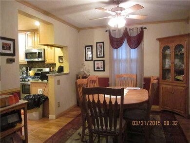 Dining Room. Exposed hardwood floor, with decorati