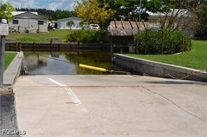 View of property's community with a boat ramp and a boat dock
