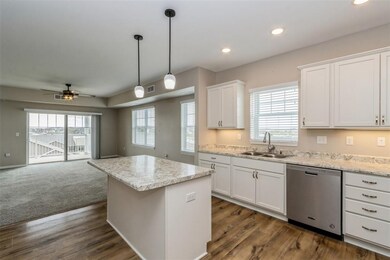 Open concept, island with electrical outlet.