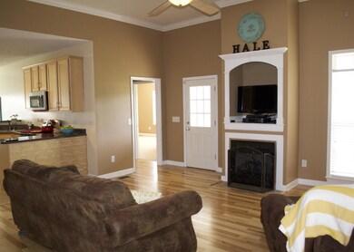 Spacious Living Room with NEW Hickory Hardwood Flooring.  Open to the Kitchen and Dining Room.