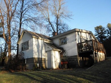Rear view of building with entry to...