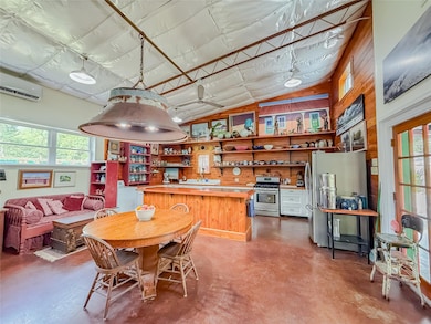 Dining room featuring finished concrete flooring,