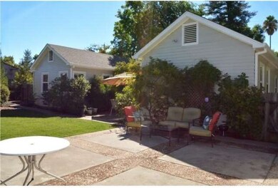 Large patio between house and garage