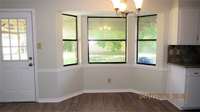 Dining area with view of backyard.