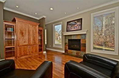 Beautiful views from hearth room to wooded area in