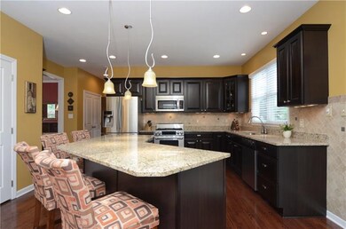 The kitchen offers granite countertops in New Vene