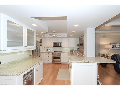 Soft close shaker cabinets (some with glass fronts), recessed lighting, farmhouse sink and faucet.