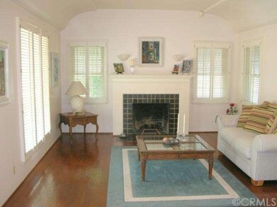 Living room, boasting 10 foot ceiling, fireplace, 
