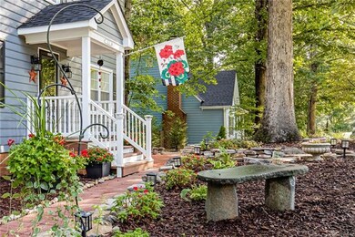 Extensive plantings and stone features add interes