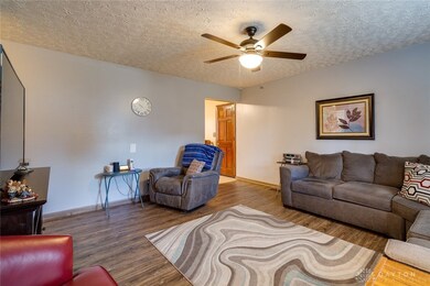 Newer flooring and overhead lighting with ceiling
