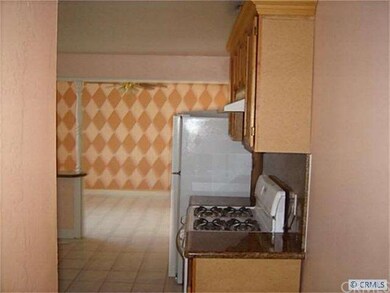 Kitchen opens to dining.