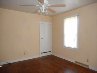 Main level bedroom with hardwood flooring