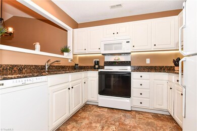 Bright white cabinets with lighting underneath