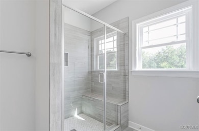 Bathroom featuring an enclosed shower