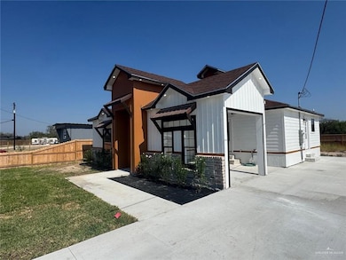 View of home's exterior with a shingled roof
