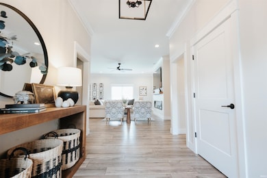 Enjoy the extra wide foyer with beautiful hard woo