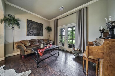 The formal living room is ideal for entertaining guests. Open up the French Doors to your front porch for some fresh air.