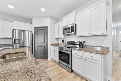 Kitchen featuring light hardwood / wood-style floo