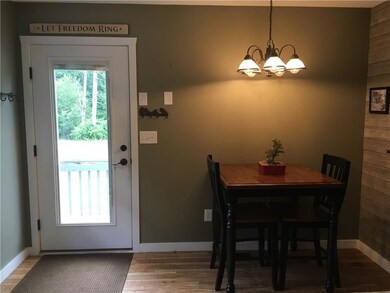 View of entrance and small area to...