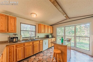 Kitchen island with views into the trees.