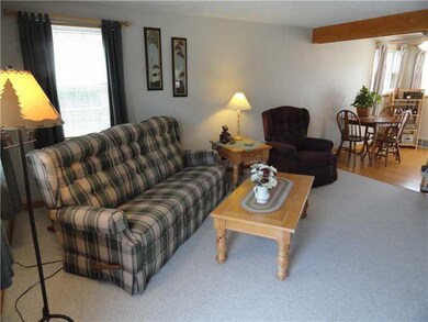 Living Room. The open floor plan of the 15  x 14  