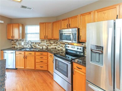 Spectacular tile backsplash with hardwoods in kitc