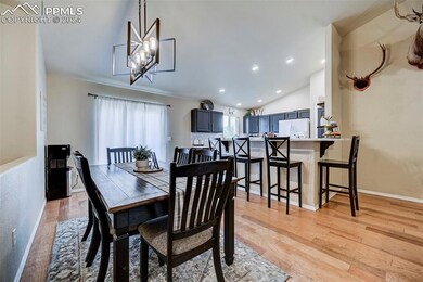 Dining area with light hardwood / wood-style floor