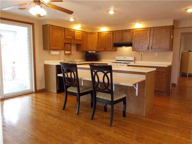Kitchen. Hardwood floor, Island, new ceiling fan w