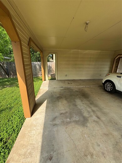 View of patio featuring fence