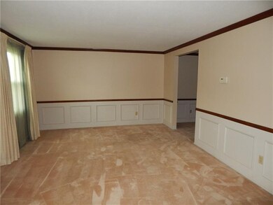 LIVING ROOM WITH CEILING MOLDING,CHAIR RAIL AND WA