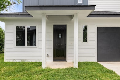 Doorway to property featuring board and batten si