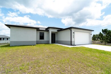 Prairie-style house featuring a garage, stucco sid